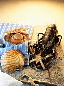 A lobster beside two scallops