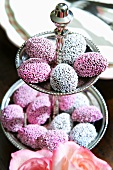 Chocolate rounds with sprinkles on a tiered stand