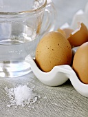 Eggs, water and salt for making omelettes