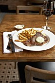Steak with chips and herb butter