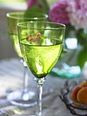 White wine in two green glasses
