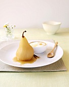 Poached pear with syrup and yoghurt