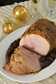 Roast ham with apricots on Christmas table