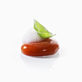 Tomato sphere with whey foam and frozen basil leaf
