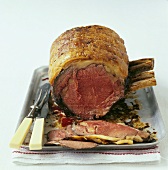 Roast rib of beef, partly carved