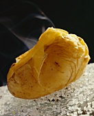 Steaming cooked potato (unpeeled) on sea salt