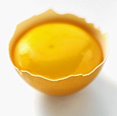 An Egg Yolk in a Piece of Brown Egg Shell