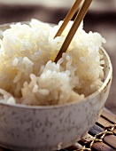 A Bowl of Cooked Rice with Chopsticks