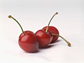 Three Wet Cherries