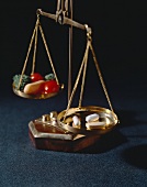 Supplements and Vegetables on a Balance Scale