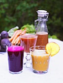 Various smoothies on a garden table