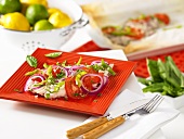 Snapper fillet with tomatoes and onions