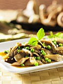 Fried oyster mushrooms with peas