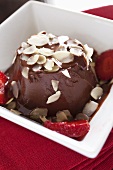 Chocolate panna cotta with slivered almonds and strawberries