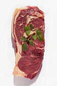 A raw ribeye steak