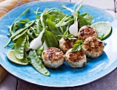 Mini chicken burgers with lime juice and salad