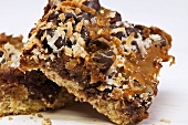 Dulce De Leche Magic Bars Made with Coconut, Almonds, Chocolate Chips and Bacon