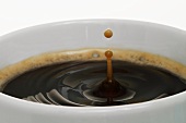 Coffee drops in a cup