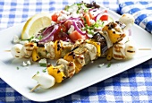 Chicken kebabs with Greek salad
