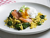 Poached egg with smoked salmon on rice with spinach