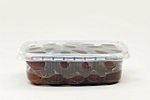 Kalamata olives in a plastic container