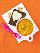 Bowl of Carrot Ginger Soup; Pumpernickel Bread with Hummus