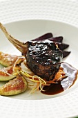 Saddle of wild boar with red wine pears and figs (Asia)