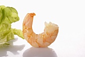 A cooked prawn and a lettuce leaf