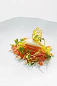 Crayfish salad with a pumpkin and sour cream tartlet and pine nuts