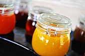 Different kinds of marmalade in jam jars
