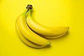 Bunch of Bananas on a Yellow Background