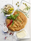 Unleavened bread, sheep's cheese, olives and jalapeños