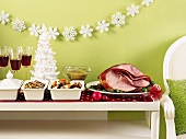 Christmas buffet table with roast ham, vegetables and rice