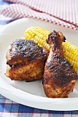 Barbecue Chicken with Corn on the Cob on a Paper Plate