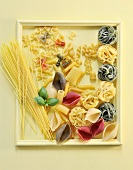 Various types of pasta in a picture frame