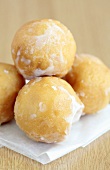 Fried dough balls with icing sugar
