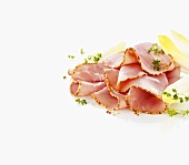 Boiled ham with a mustard crust, sliced