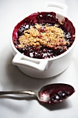 Mixed Berry Crumble in Baking Dish with Spoon