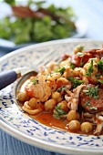 Chickpea stew with seafood and chorizo