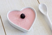 Raspberry flan in a heart-shaped dish