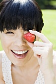 Young woman with strawberry