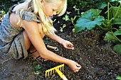 A girl planting seeds