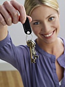 A woman holding keys