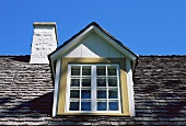 A roof window and a chimney