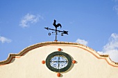 A weather vane on a building