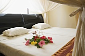 Flowers on a double bed