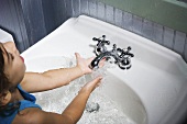 A girl washing her hands