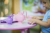 A girl having a tea party