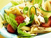 Pasta salad with courgettes, tomatoes and basil