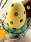 White chocolate egg in Easter basket